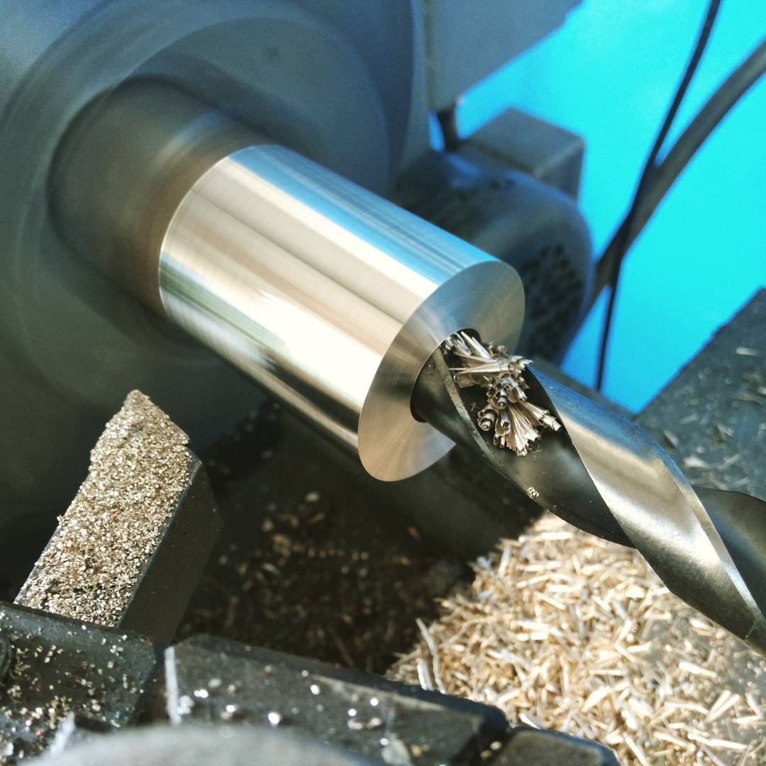 CNC lathe machining an aluminum part